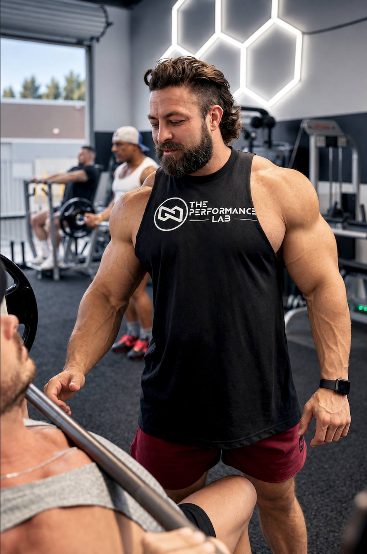 Luke coaching a client through a bench press in The Performance Lab studio